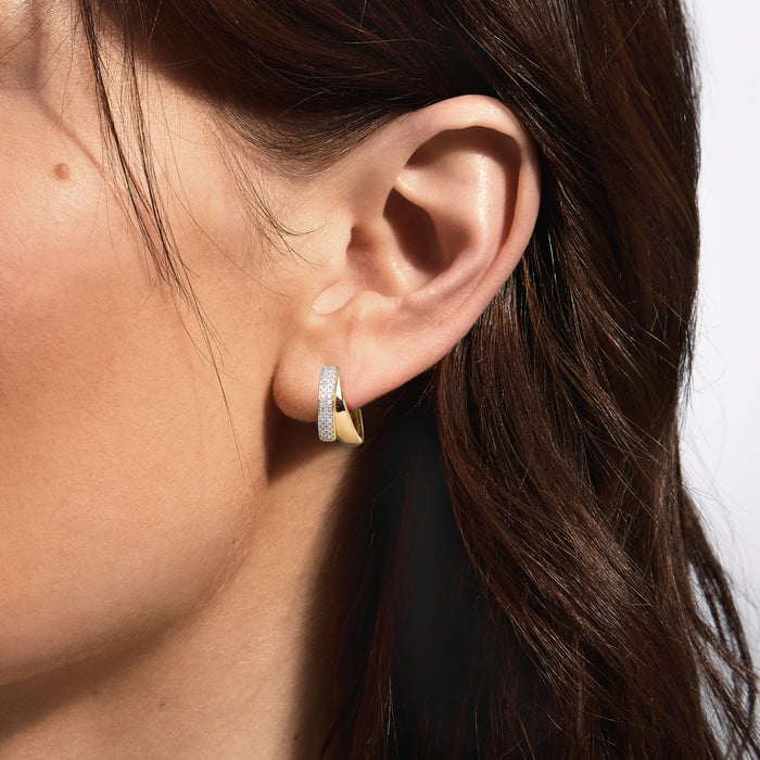 Gold double-hoop earrings with glittering pave outer hoop in close-up