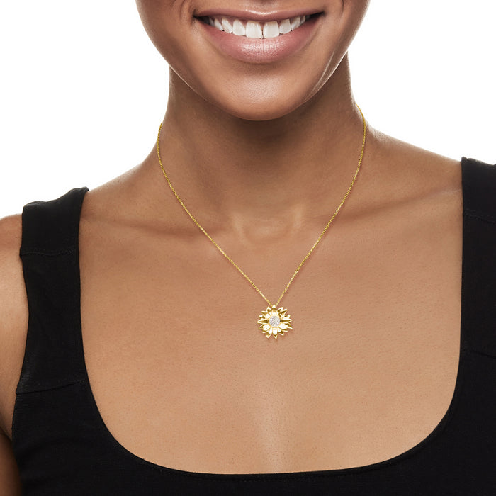 Sunflower pendant necklace on gold chain, worn at collar with small round center