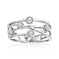 Sterling silver crisscross diamond ring with four round stones, polished band.