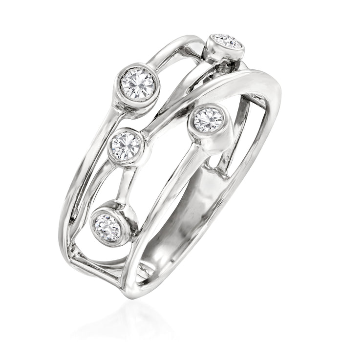 Sterling silver crisscross diamond ring angled view with five round bezel-set stones.