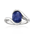 Sterling silver ring with oval dark-blue sapphire center stone, twisted band