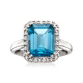 Sterling silver ring with large blue topaz center and diamond halo, cushion cut