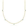 Gold station necklace with London blue topaz stones and small diamond accents