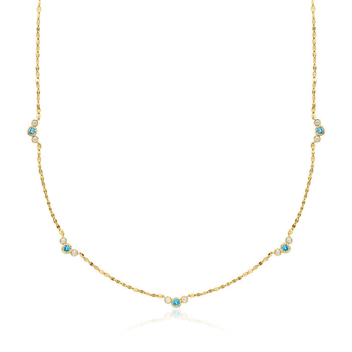 Gold station necklace with London blue topaz stones and small diamond accents