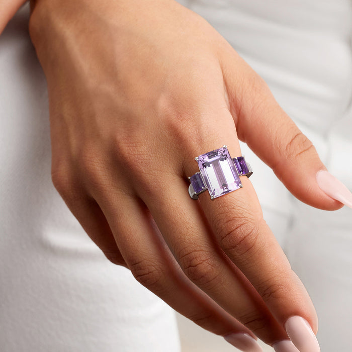 Sterling silver amethyst ring on hand with emerald-cut rectangular center stone