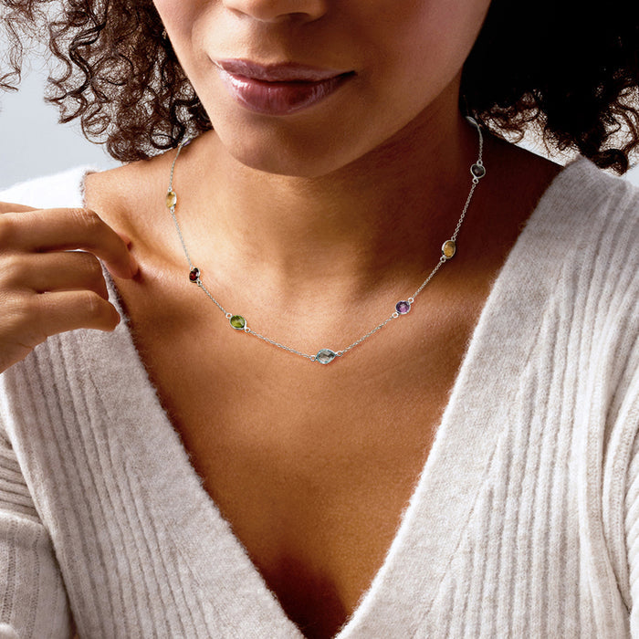 Sterling silver necklace featuring multicolor gem stations spaced along the chain