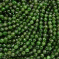 Close-up of green beads with a faceted texture