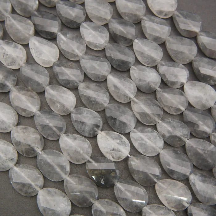 Cloudy clear twisted oval beads.