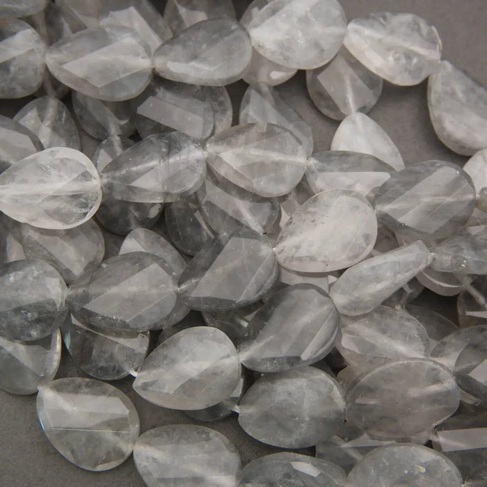 Cloudy clear twisted oval beads.