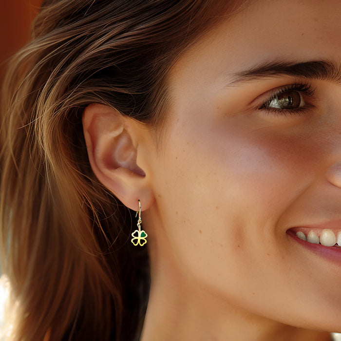Shamrock drop earrings with green enamel in 14kt yellow gold, worn on earwires