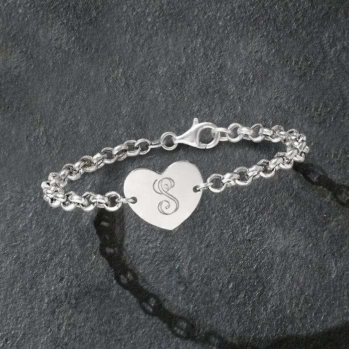 Sterling silver bracelet with heart charm, engraved monogram, and adjustable clasp.