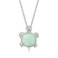 Sterling silver turtle pendant necklace with jade green gemstone and diamond accents