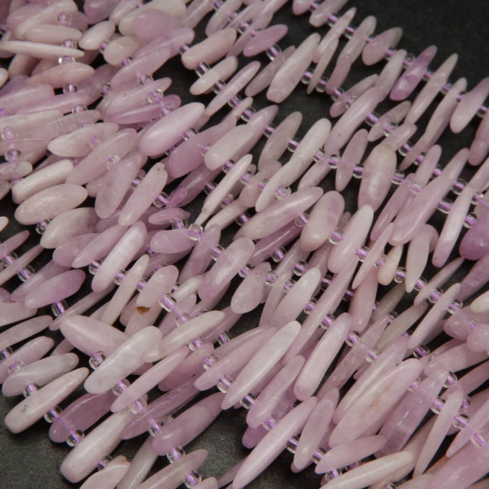 Pink kunzite stick shape beads.