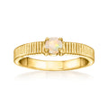 Gold over sterling ring with ridged band and round opal centerpiece