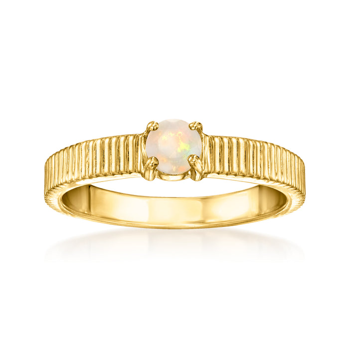 Gold over sterling ring with ridged band and round opal centerpiece