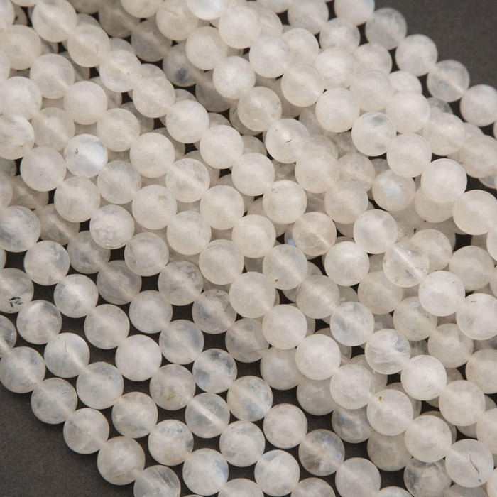 Close-up of white beads on a dark background