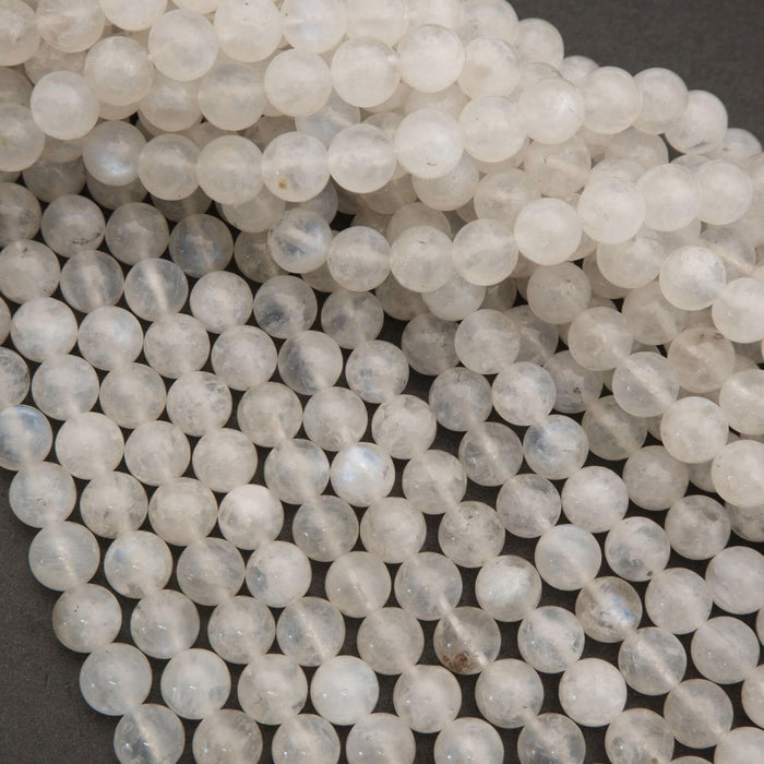 Close-up of white beads on a dark background