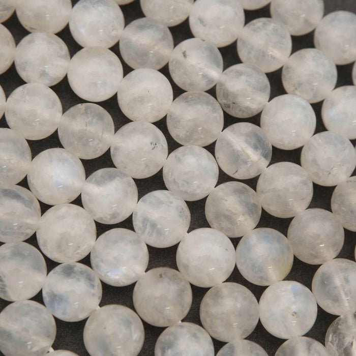 Close-up of white beads on a dark background