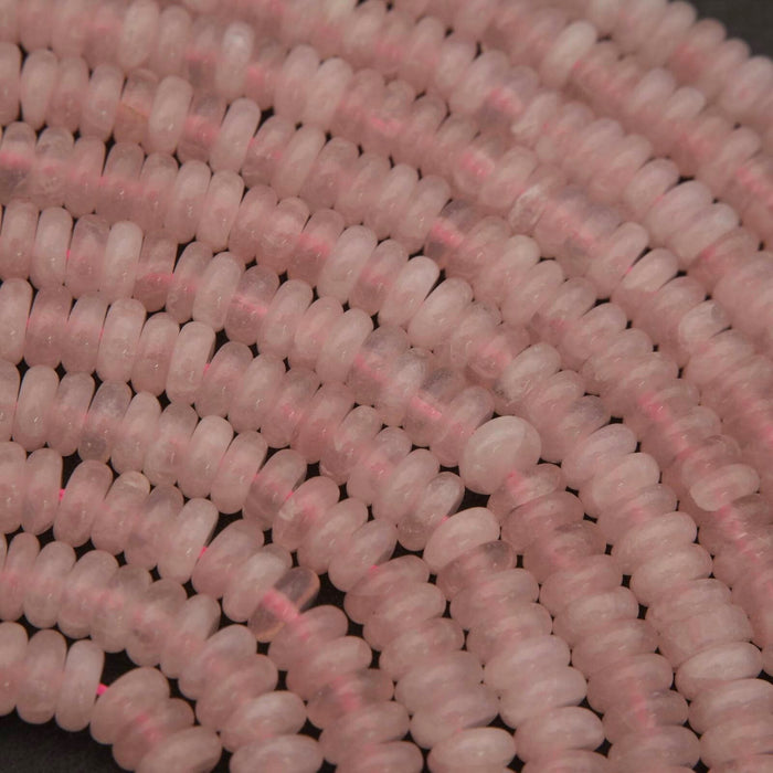 Close-up of pink beads on a dark background
