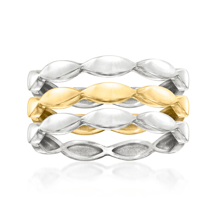 Three wave rings in silver and gold-tone metal, polished oval links in a stack