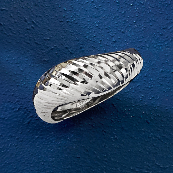 Sterling silver sculptural ring with diamond-cut ridges and polished inner band