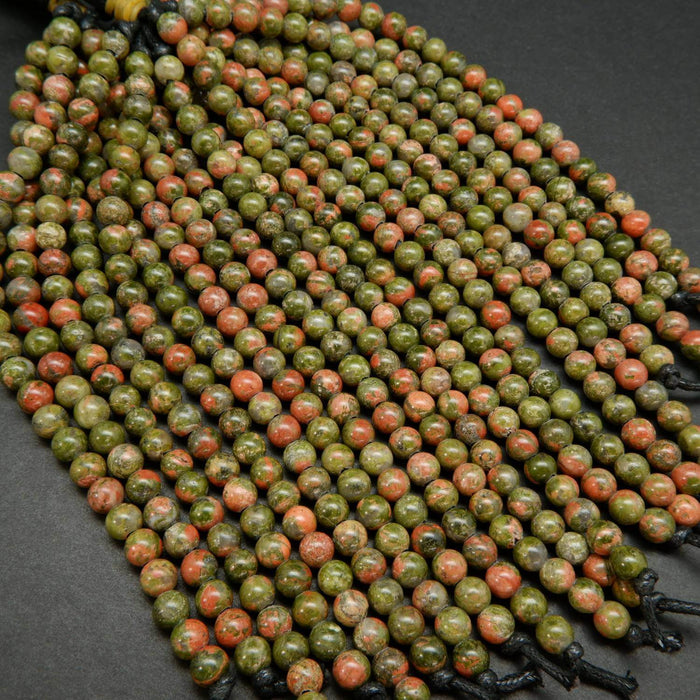 Drab green and pinkish orange unakite large hole beads.